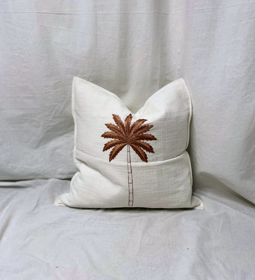 White Linen Cushion with a brown sewn detail on front in studio