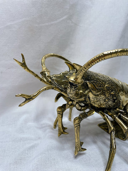 Close up of brass lobster home decor