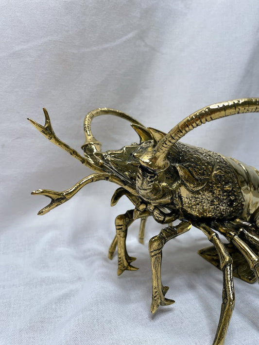 Close up of brass lobster home decor