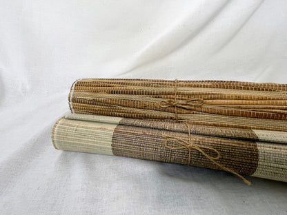 Two rolled up medong grass table runners