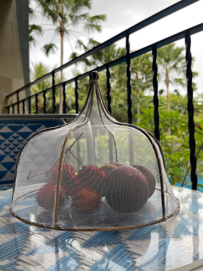 Food Cover covering food in a tropical setting