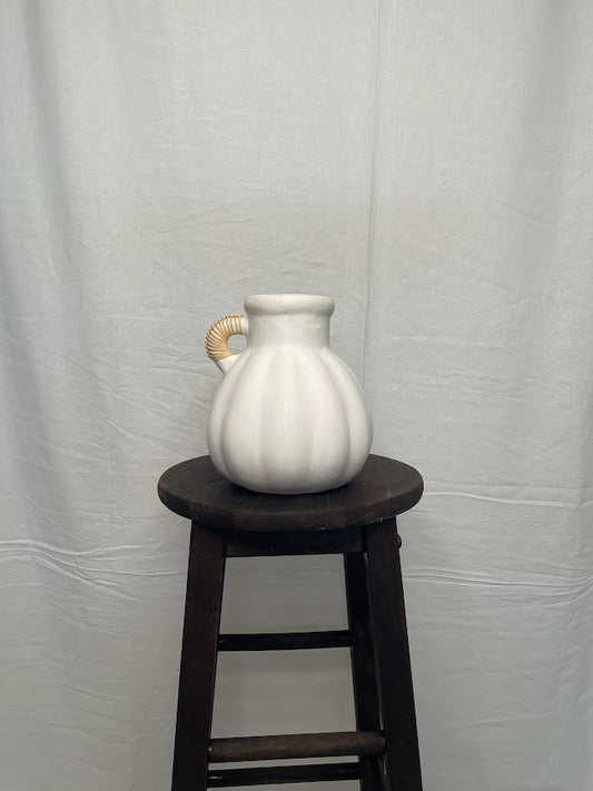 Pumpkin detailed white terracotta vase pot with a single rattan wrapped handle 