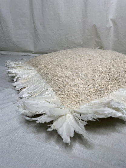 Details of natural linen cushion with feathers