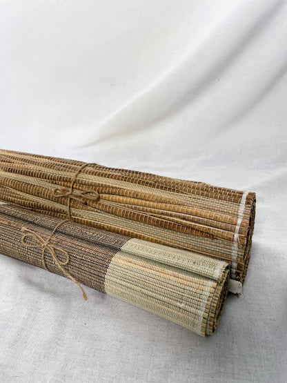 Two rolled up table runners in studio