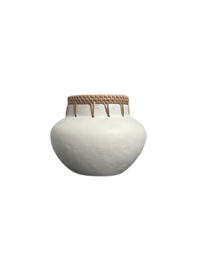 White vase pot with rattan detailing on the top outter rim