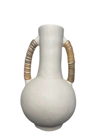 Tall pottery vase in white with two large handles either side, wrapped in rattan